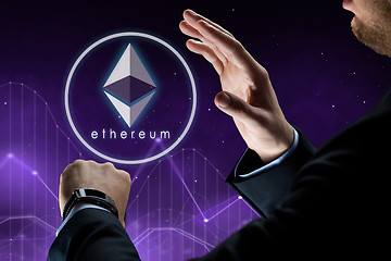 Image showing hands with smart watch and ethereum hologram