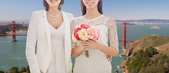 Image showing female gay couple wedding over golden gate bridge