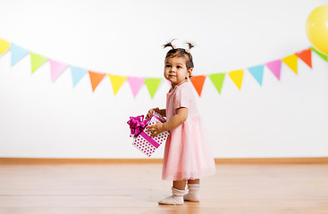 Image showing happy baby girl with gift box on birthday party