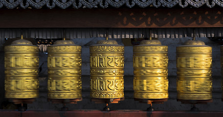 Image showing Buddhist prayer wheels rotating in motion