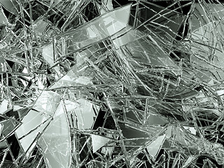 Image showing Pieces of glass broken or cracked on black