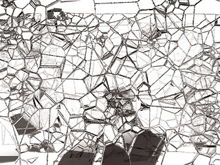 Image showing Pieces of shattered or cracked glass on white