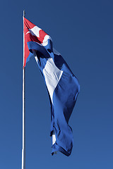 Image showing Waving Cuba flag and blue sky