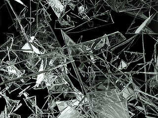 Image showing Pieces of glass broken or cracked on black