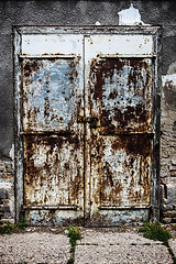 Image showing Old blue rusty metal door with lock