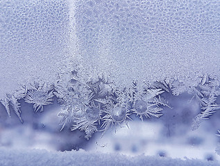 Image showing Ice pattern and frozen water drops on glass