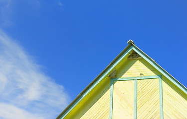 Image showing Part Of A Rustic Wooden Building Against The Sky