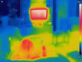 Image showing Thermal image Photo while a woman is watching television