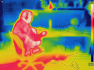 Image showing Thermal image Photo while woman listening to music on the headph