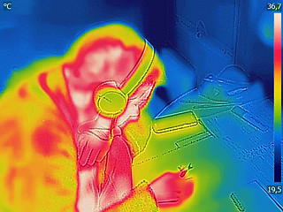 Image showing Thermal image Photo while woman listening to music on the headph