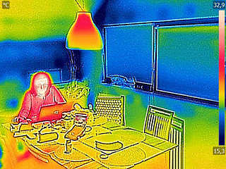 Image showing Thermal image Photo while woman on a laptop 