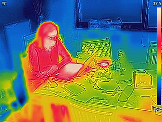 Image showing Thermal image Photo while woman on a laptop 