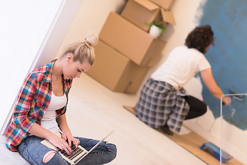 Image showing Happy couple doing home renovations