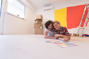 Image showing Happy young couple relaxing after painting