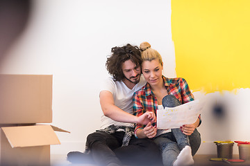 Image showing Happy young couple relaxing after painting