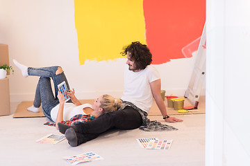 Image showing Happy young couple relaxing after painting