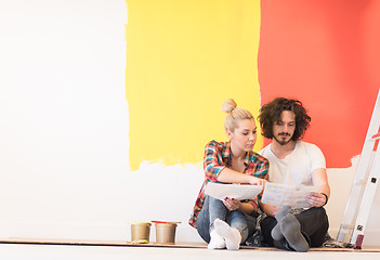 Image showing Happy young couple relaxing after painting