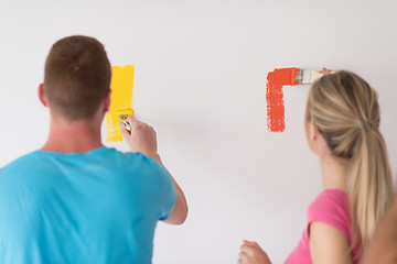 Image showing couple painting interior wall
