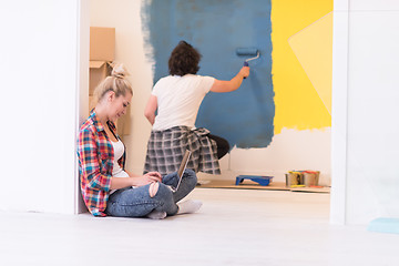 Image showing Happy couple doing home renovations