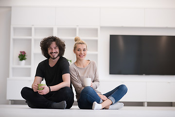 Image showing young couple in their new home