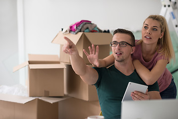 Image showing Young couple moving in a new home