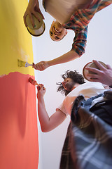 Image showing couple painting interior wall