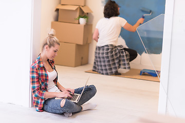 Image showing Happy couple doing home renovations