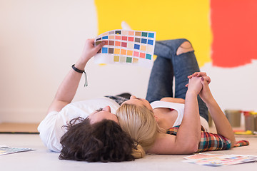 Image showing Happy young couple relaxing after painting