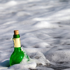 Image showing Bottle of wine in sea surf