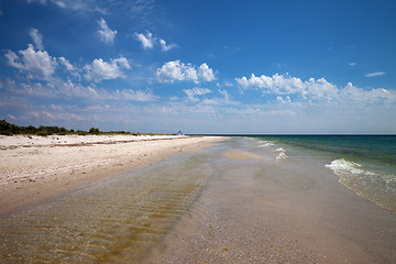 Image showing Clear sea with sand beach and blue sky with clouds