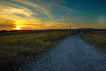 Image showing orange colors of dawn on rural landscape