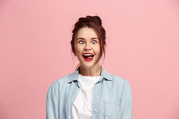 Image showing The squint eyed woman with weird expression isolated on pink