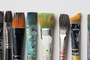 Image showing close up of dirty paintbrushes from top