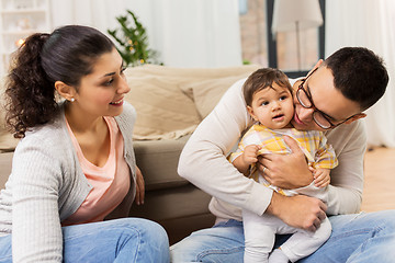 Image showing happy family with baby daughter at home