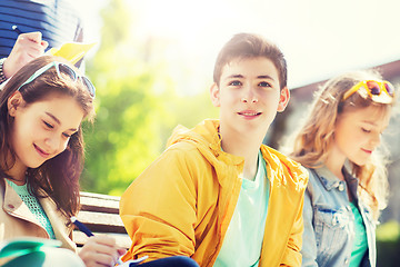 Image showing group of students with notebooks at school yard