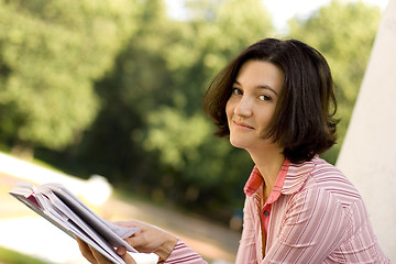 Image showing woman reading in park