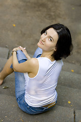 Image showing woman sitting on a staircase