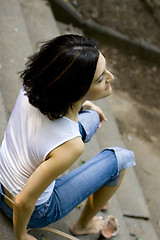 Image showing woman sitting on a staircase