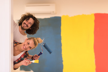 Image showing portrait of a couple painting interior wall