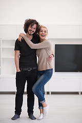 Image showing couple hugging in their new home