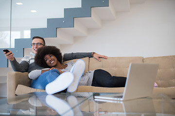 Image showing multiethnic couple relaxing at home