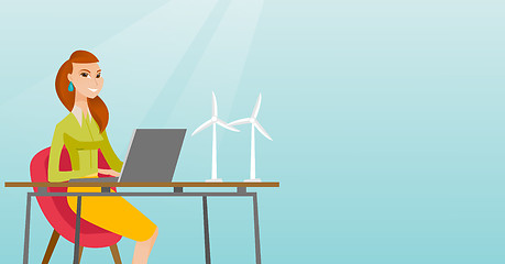 Image showing Woman working with model of wind turbines.