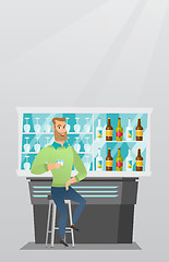 Image showing Caucasian man sitting at the bar counter.