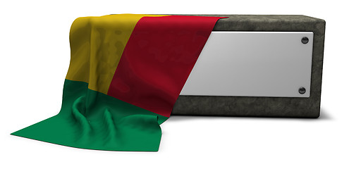 Image showing stone socket and flag of benin