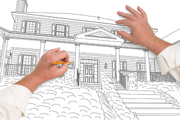 Image showing Male Hands Sketching with Pencil the Outline of a Beautiful Hous