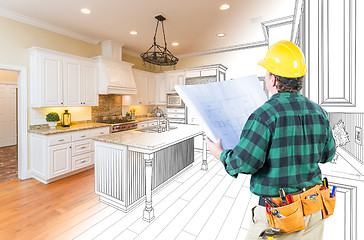 Image showing Male Contractor with Hard Hat and Plans Looking At Custom Kitche