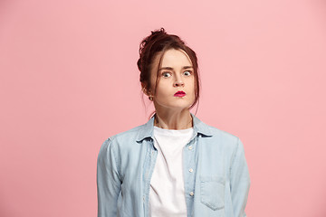 Image showing Portrait of an angry woman looking at camera isolated on a pink background