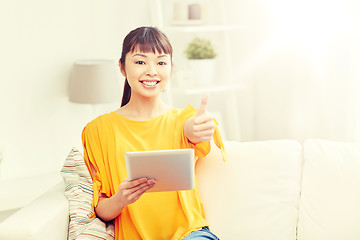 Image showing happy asian woman with tablet pc and thumbs up