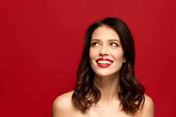 Image showing beautiful smiling young woman with red lipstick