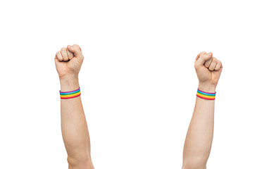 Image showing hands with gay pride rainbow wristbands shows fist